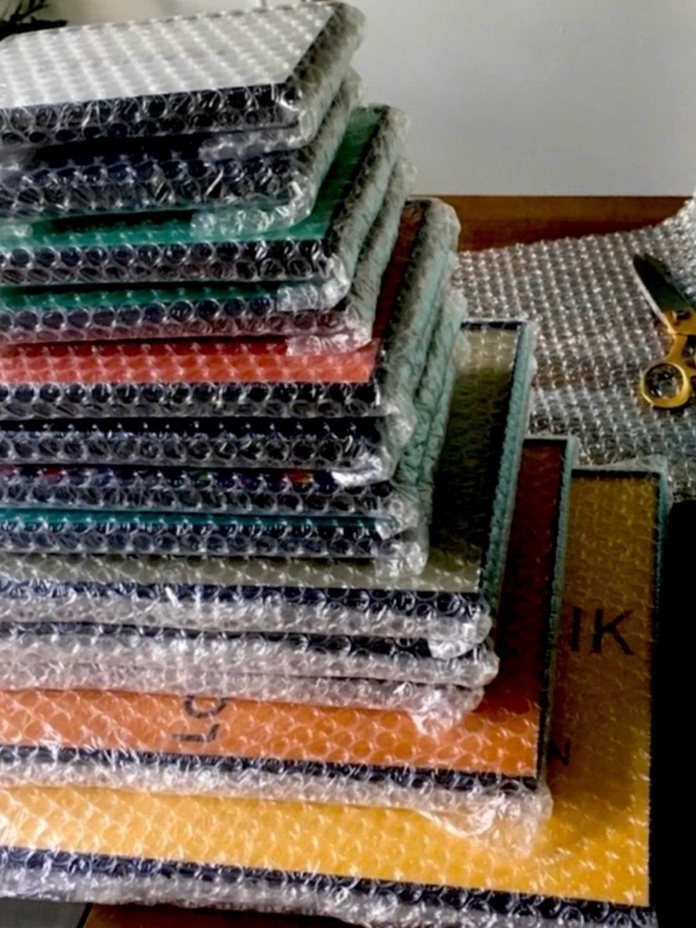 Handcrafted wall decor from authentic designer boxes and bags